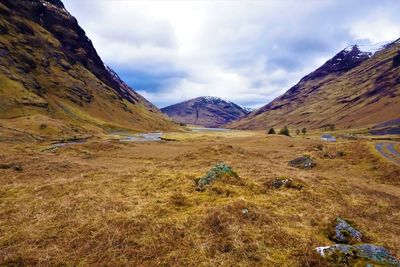 Scenic view of landscape and mountains against sky