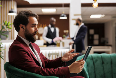 Side view of business colleagues working at office