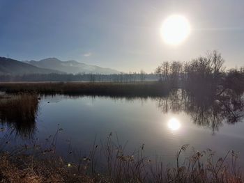 Scenic view of lake against sky during sunset