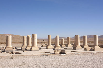 Architectural columns in row against clear sky