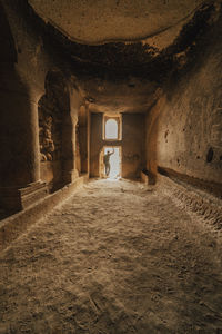 Man walking in corridor of historic building