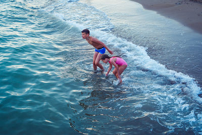 Kids bathing in sea