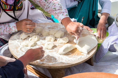 Midsection of people having food