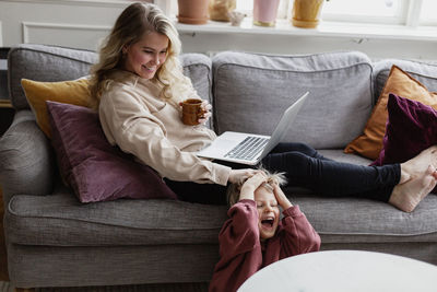 Mother with son in living room