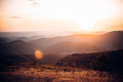 Scenic view of landscape against sky during sunset
