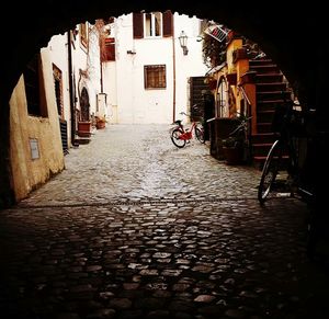 Walkway amidst buildings