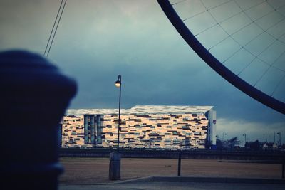 View of buildings against cloudy sky