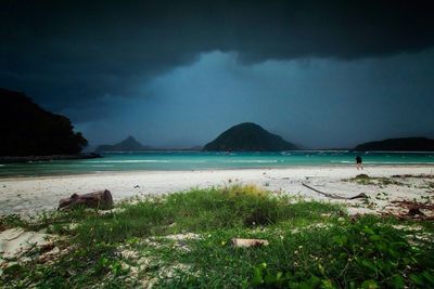 Scenic view of sea against cloudy sky