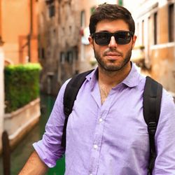 Young man wearing sunglasses standing outdoors