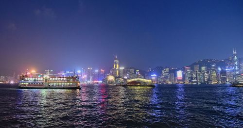 Illuminated buildings in city at night