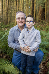 Outdoor portrait of grandpa and grandson.