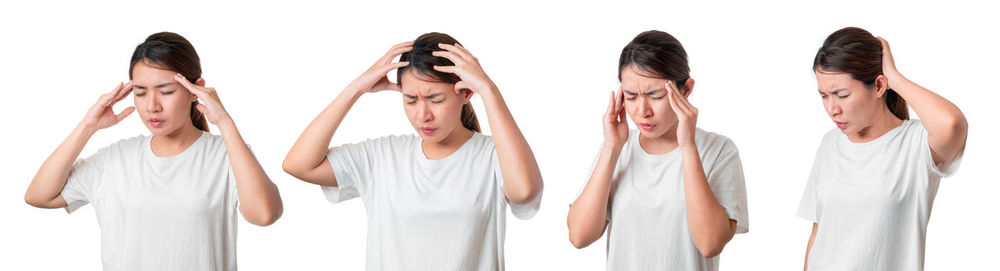 Low section of woman standing against white background