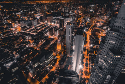 High angle view of illuminated buildings in city at night