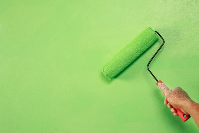 High angle view of usb stick against green background