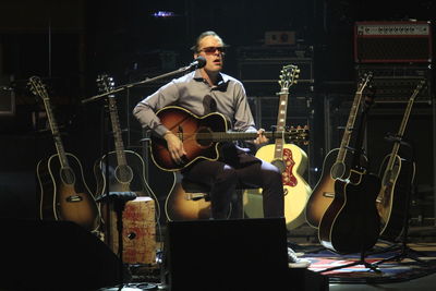 Full length of man playing guitar