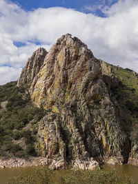 Rock formations on mountain against sky