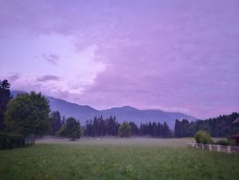 Scenic view of field against sky during sunset