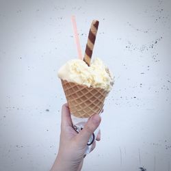 Close-up of hand holding ice cream cone