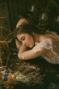 Portrait of woman lying down on land