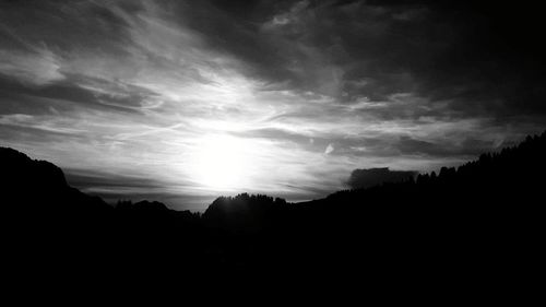 Silhouette landscape against sky during sunset