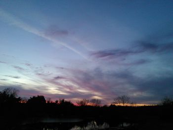 Scenic view of landscape against sky at sunset