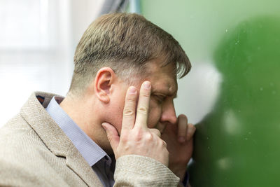 Close-up portrait of man making face