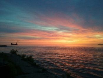 Scenic view of sea at sunset