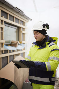 Engineer using digital tablet at building site