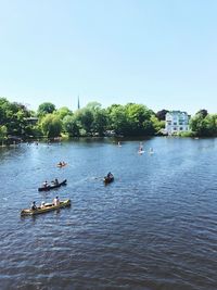 High angle view of people boat sailing on sea against clear sky