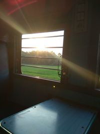 Scenic view of field seen through train window