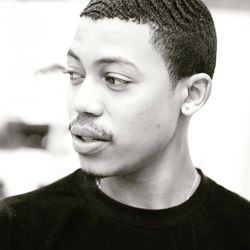 Portrait of smiling young man looking away, handsome, 