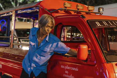 Portrait of man standing in bus