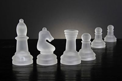 Close-up of chess pieces on table