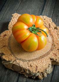 High angle view of tomato on cutting board