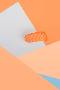 Low angle view of multi colored paper against wall