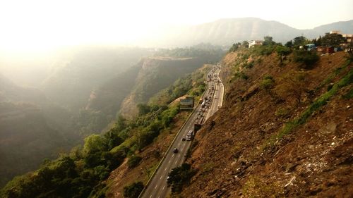 Scenic view of mountains against cloudy sky