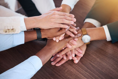 Cropped image of couple holding hands