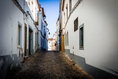 Narrow alley amidst buildings in city