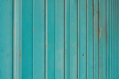 Full frame shot of blue metallic wall