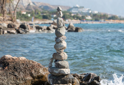 Stacked stones to the tower built on the beach of kos greece