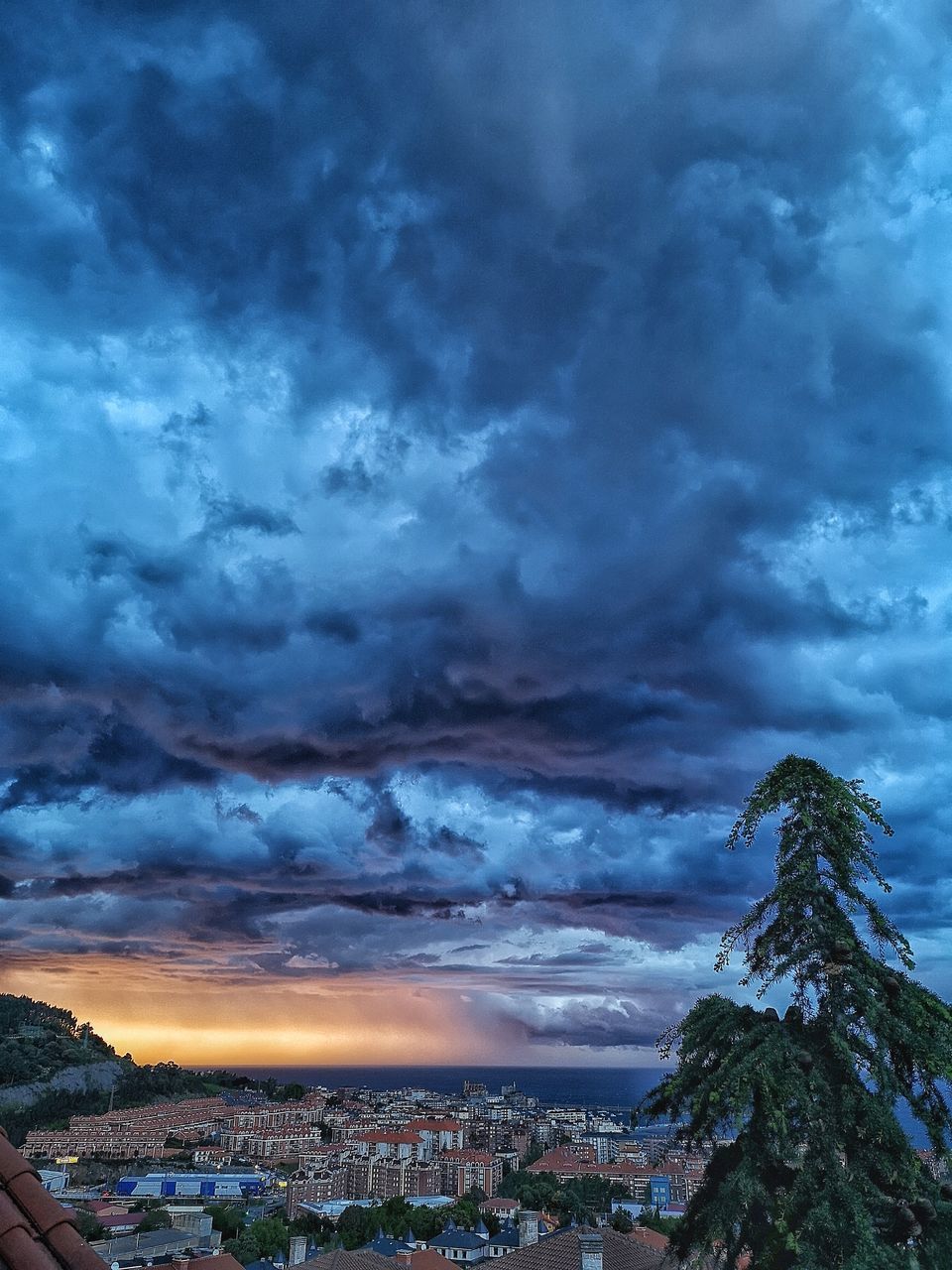 STORM CLOUDS OVER CITY