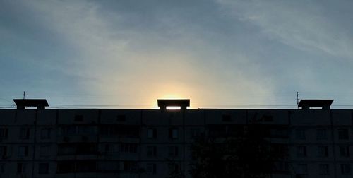 Low angle view of building against sky during sunset