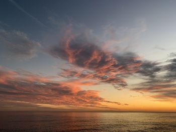 Sunset over the sea, natural light and colors, horizon, infinity, immensity, tranquility, orange sky 