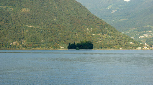 Scenic view of sea against mountain