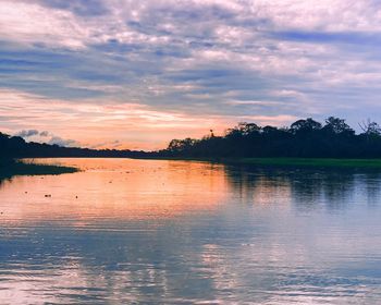 Scenic view of lake against sky during sunset