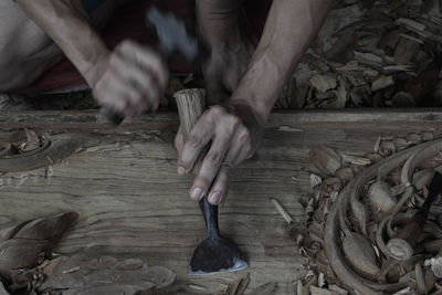 Cropped image of carpenter working in carpentry workshop