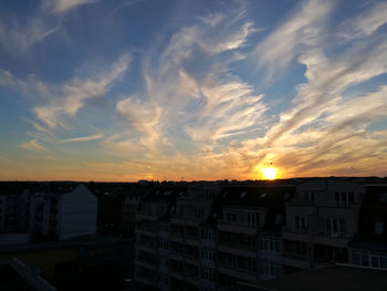 Cityscape against sky during sunset