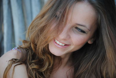 Close-up portrait of a smiling young woman