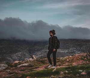 Walking on a hill in athens, greece, with the mask always on.