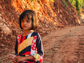Portrait of cute girl looking away